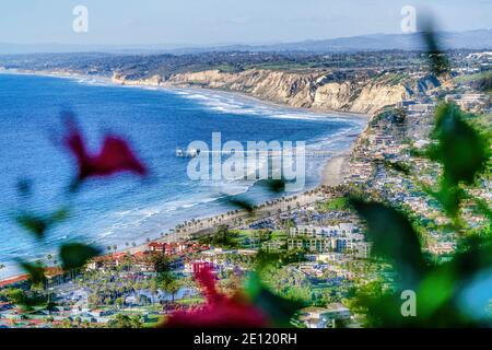 Blue ocean with pier at San Diego California with cloudy sky on an aerial view Stock Photo