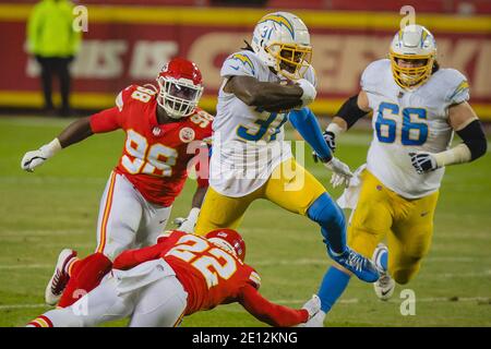 Kansas City, United States. 03rd Jan, 2021. Los Angeles Chargers running back Kalen Ballage (31) leaps over Kansas City Chiefs free safety Juan Thornhill (22) in the third quarter at Arrowhead Stadium in Kansas City on Sunday, January 03, 2021. Photo by Kyle Rivas/UPI Credit: UPI/Alamy Live News