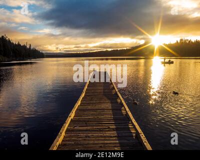 Two fishermen in a boat at sunrise on Suttle Lake, Oregon. Stock Photo
