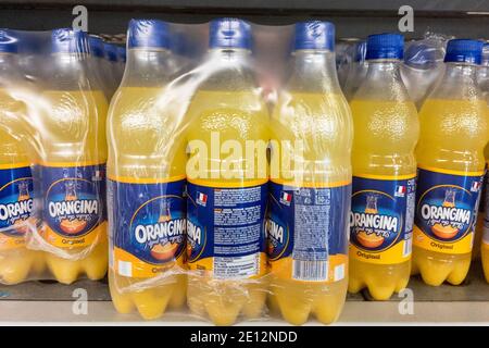 BELGRADE, SERBIA - DECEMBER 27, 2020: Logo of  Orangina on bottles for sale in Belgrade. orangina is a french brand of orange soda carbonated drinks. Stock Photo