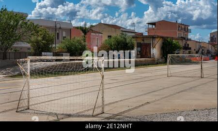 Football On A Concrete Playing Field, Italy Stock Photo