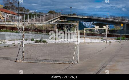 Football On A Concrete Playing Field, Italy Stock Photo