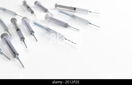 3D vaccines over white background. Vaccination concept. Close up view. Copyspace. Stock Photo