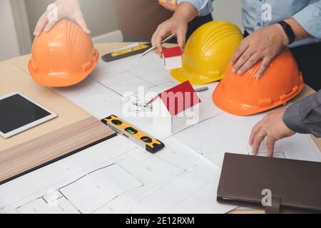 Engineer and Architect concept, Engineer Architects  and Interior designer working with blueprints Stock Photo