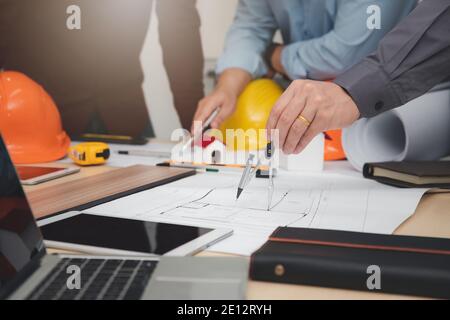 Engineer and Architect concept, Engineer Architects  and Interior designer working with blueprints Stock Photo