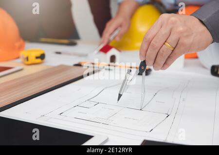 Engineer and Architect concept, Engineer Architects  and Interior designer working with blueprints Stock Photo