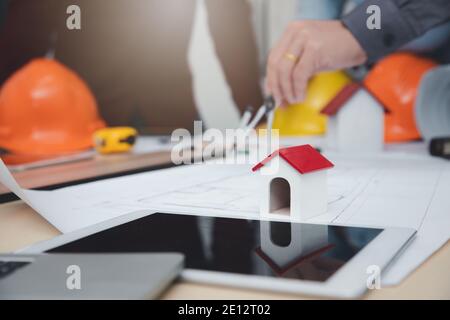 Engineer and Architect concept, Engineer Architects  and Interior designer working with blueprints Stock Photo