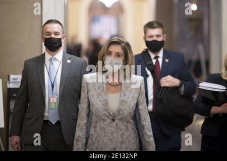 Washington, United States. 03rd Jan, 2021. Speaker of the United States House of Representatives Nancy Pelosi (Democrat of California) walks from the House chamber to her office at the U.S. Capitol as the 117th Congress convenes in Washington, DC, Sunday, January 3, 2021. Photo by Rod Lamkey/CNP/ABACAPRESS.COM Credit: ABACAPRESS/Alamy Live News Stock Photo