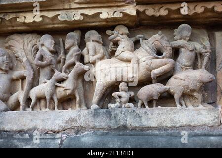 Sculpture of people hunting, Khajuraho, Madhya Pradesh, India Stock Photo