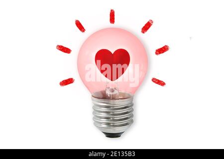 Pink light bulb with heart on white background - Concept of heart and brain connection Stock Photo