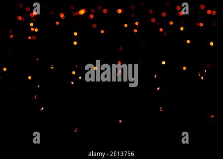 light dots black background. blurred abstract pattern, bokeh background. Stock Photo
