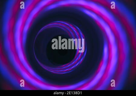 Abstract swirl tunnel with purple light on a background pattern textured for design. Stock Photo