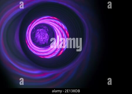 Abstract swirl tunnel with purple light on a background pattern textured for design. Stock Photo