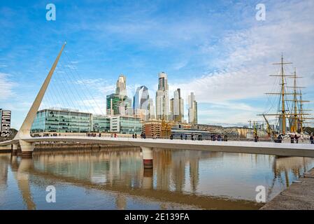 Puente de la Mujer by architect Santiago Calatrava in Puerto Madero district, Buenos Aires, Argentina. Modern buildings and an old vessel Stock Photo