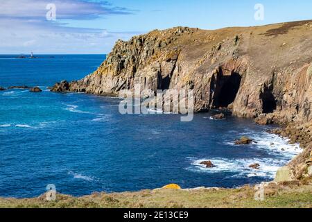 Detailed Image of Cornish Coast Near Lands End. Granite Cliff View of Pendower Coves with Higher Bosistow Cliff, Coast Path and Distant Longships Ligh Stock Photo