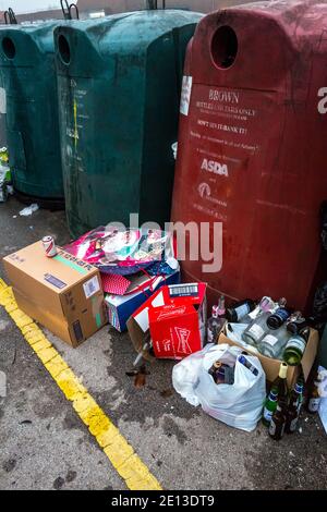 Empty glass bottles at bottle bank after Christmas. Stock Photo