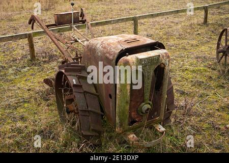 Old farming machinery in field British Anzani Iron Horse Tractor 1940s Stock Photo