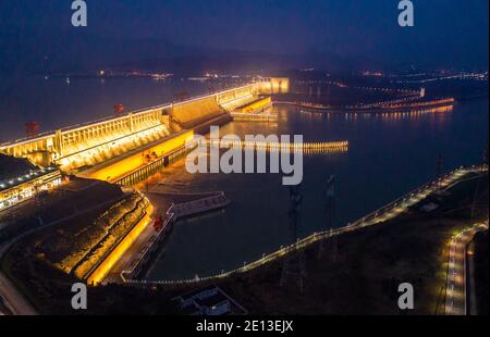 Yichang. 31st Dec, 2020. Aerial photo taken on Dec. 31, 2020 shows a night view of the Three Gorges Dam in central China's Hubei Province. The Three Gorges Hydroelectric Power Station on China's Yangtze River has generated 111.8 billion kWh in 2020, a new world record. TO GO WITH 'Three Gorges hydropower station hits world record of electricity generation' Credit: Zheng Jiayu/Xinhua/Alamy Live News