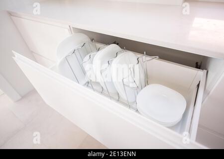 Plates in a kitchen drawer Stock Photo
