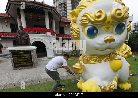 Singapore. 4th Jan, 2021. Workers decorate an art work installation as part of the upcoming lunar New Year celebrations at the Sun Yat Sen Nanyang Memorial Hall in Singapore on Jan. 4, 2021. Credit: Then Chih Wey/Xinhua/Alamy Live News Stock Photo