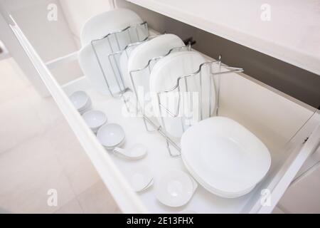 Plates in a kitchen drawer Stock Photo