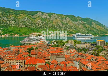 Kotor Old Town with Cruise ships 'Emerald Princess' and 'Seabourn Odyssey' in Kotor bay, Montenegro. Stock Photo