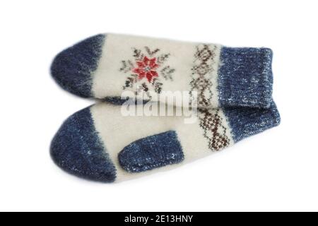 Winter woolen knitted mittens close up isolated on white background Stock Photo