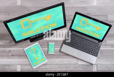Solution concept shown on different information technology devices Stock Photo