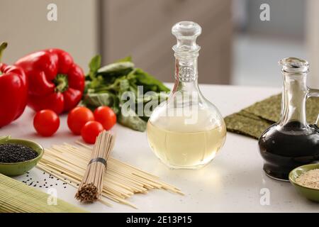 Composition with rice vinegar  on table Stock Photo