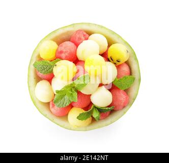 Tasty watermelon balls in ripe watermelon on white background Stock Photo