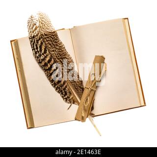 Old book with feather and scroll on white background Stock Photo