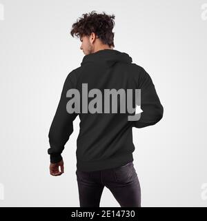 Mockup of a black sweatshirt on a guy, back view, branded hoodie with a hood, for advertising, print. Stylish men's clothing template for presentation Stock Photo