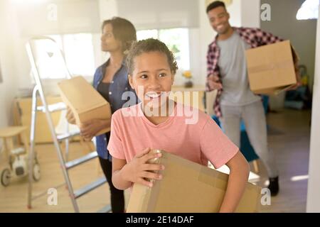Happy african-american family moving in brand new home Stock Photo