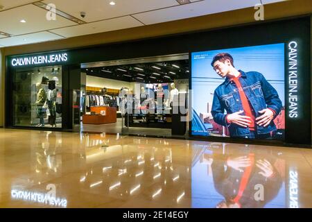 Shanghai,  CHINA, Contemporary Interiors, Shopping Center,  HKRI Taikoo Hui, American International Advertising poster, Calvin Klein, Store Front, contemporary retail interior design, china capitalism, china luxury shopping Stock Photo