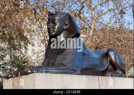 One of two Sphinx guarding Cleopatra's Needle on Victoria Embankment in London England UK erected in 1878 and is a popular tourist travel destination Stock Photo