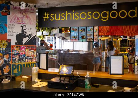 Mojo Market- Cape Town, South Africa - 16/12/2020 Cute and playfully themed sushi bar in Mojo Market. Busy market in background. Stock Photo