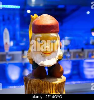 Mojo Market- Cape Town, South Africa - 16/12/2020 Cute little bar gnome. Standing on a countertop of a bar in Mojo Market near funky neon blue window. Stock Photo