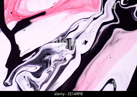 Marbled acrylic colored pattern in the colors red, black, white and pink. Stock Photo