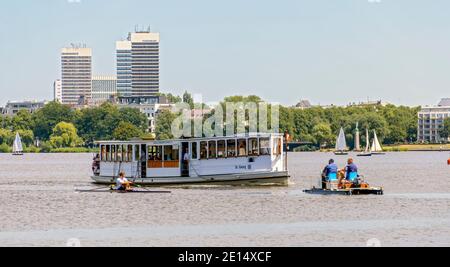 rowing boat, electric catamaran and historic exursion ship on the Outer Alster Lake of Hamburg, Germany Stock Photo