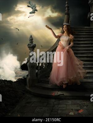 surreal fairy tale art background with girl in pink dress, sea, rocks, splashing waves, and seagulls flying Stock Photo