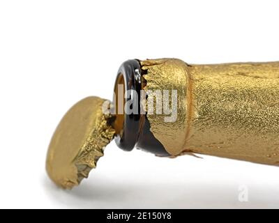 Opened beer bottle and crown cap with gold paper Stock Photo