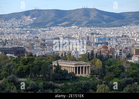 Athens - December 2019: view of Temple of Hephaestus with Athens in background Stock Photo