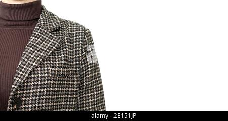 Young woman wearing stylish brown tweed houndstooth pattern jacket or blazer close-up. Banner with copy space Stock Photo