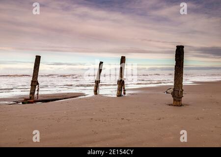 Wooden groynes on Prestatyn Beach, North Wales Stock Photo