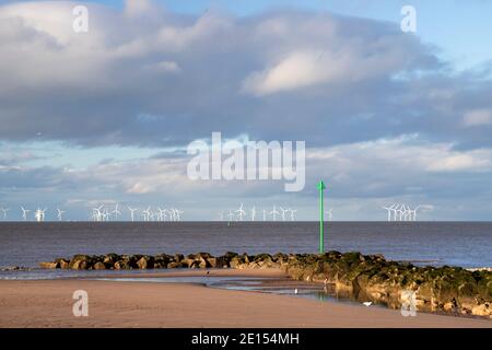 Breakwater and offshore turbines, Prestatyn Beach, North Wales Stock Photo