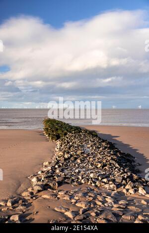 Breakwater and offshore turbines, Prestatyn Beach, North Wales Stock Photo