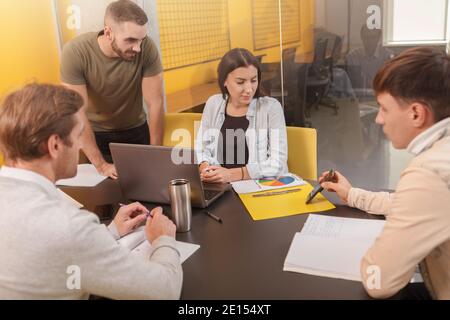 Group of creative designers discussing business during a meeting at boardroom Stock Photo
