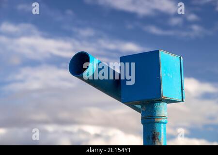 Blue seaside telescope at Prestatyn, North Wales Stock Photo