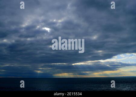 Dramatic Clouds and Rays Over the Sea, Seen from the Isle of Portland, Dorset Stock Photo