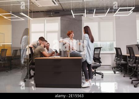 Young people working at modern open space office, copy space Stock Photo